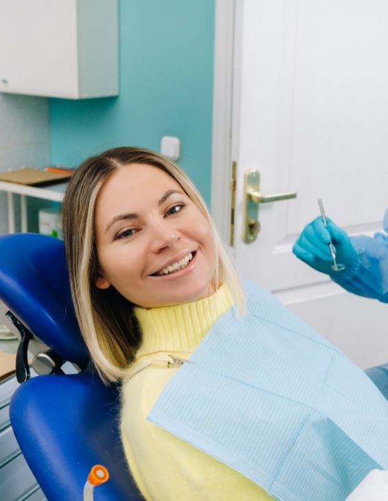 smiling woman at a dental cleaning in Tucson, AZ